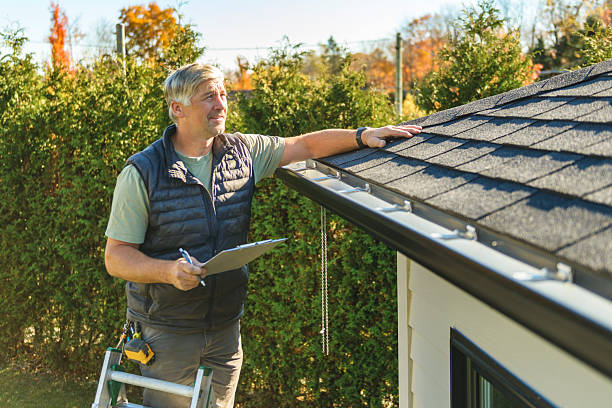 Professional Hail Damage Roof Repair technician working in Williamsfield, IL